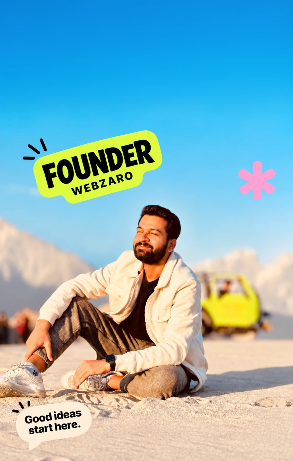 Faizan sitting in warm sunlight against a mountain landscape
